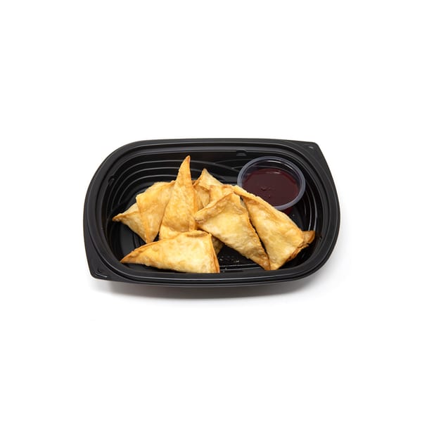 Imperial Chinese crab rangoon with a side of sweet and sour sauce in a black to-go container.