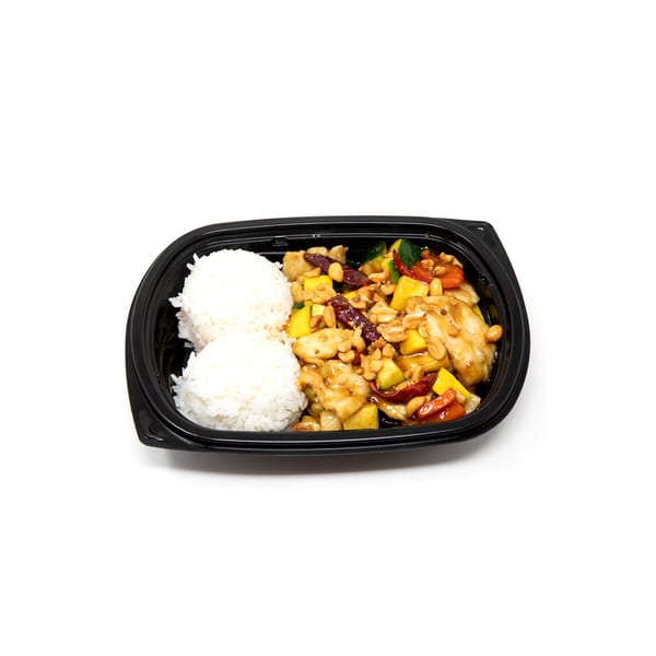 Imperial Chinese Kung Pao Chicken with rice, mango, zucchini, and cashews in a black takeout container.